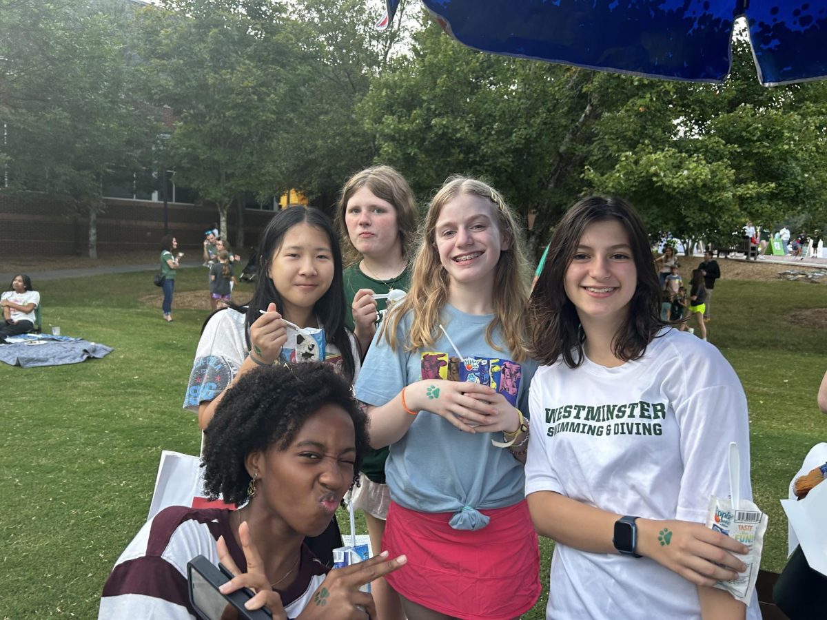 8th-graders Katherine Su, Mary Adelaide Gump, Holly Johnson, Sierra Malek, and McKenzie-Love Jordan posing for an ice cream photoshoot.