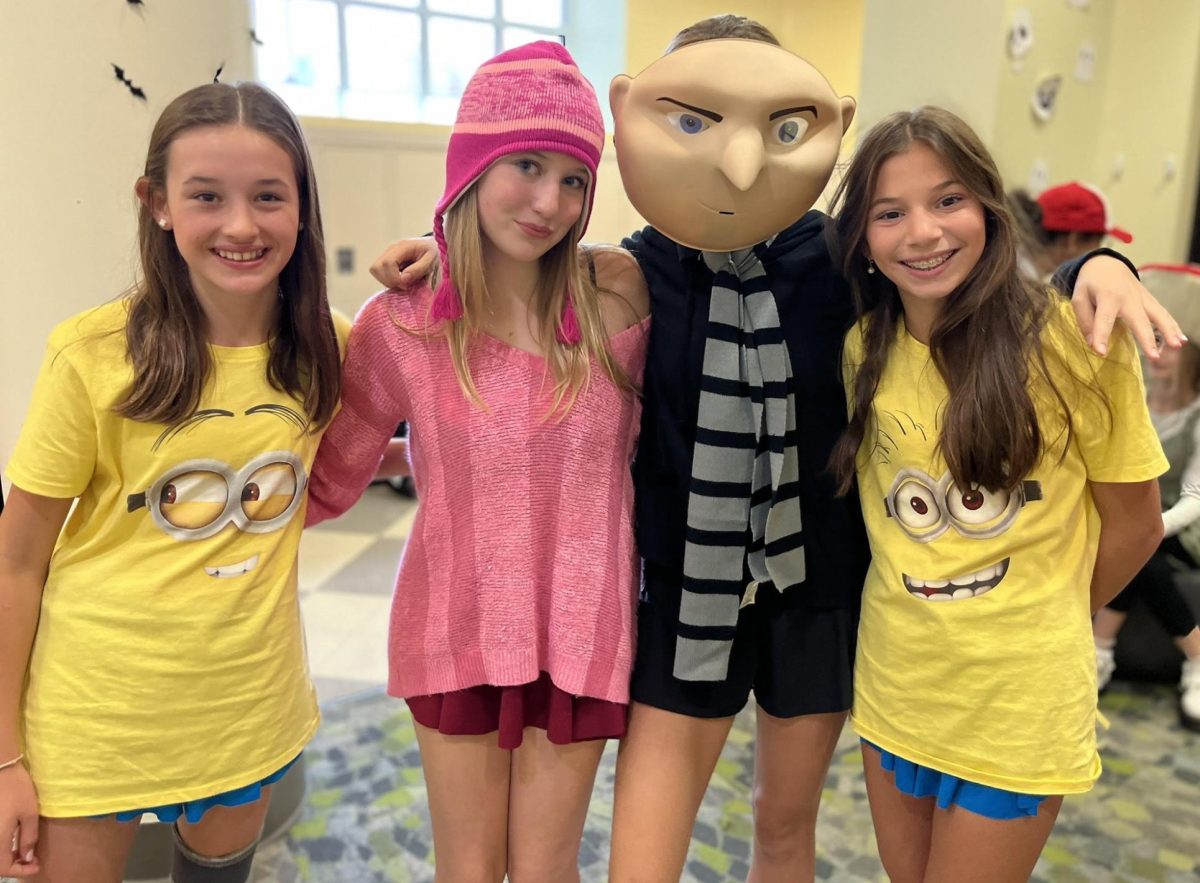 Ellie Meacham, Caroline Harris Sanford, Eliza Hunter, and Lucy Lindenbaum, Class of ‘29, dressed as Gru, Edith, and the Minions from the Minions Movie. 