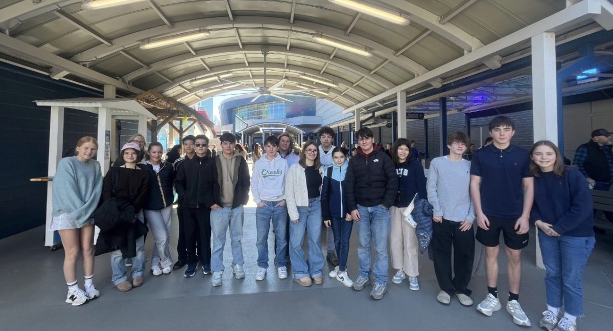 2026 French Exchange hosts and students at Georgia Aquarium